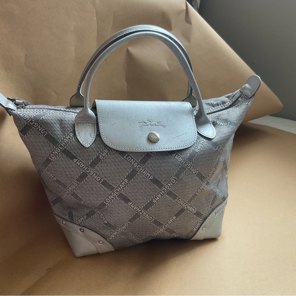Longchamp Handbags - Longchamp silver mini handbag